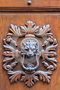 Door knocker in Montalcino town, Val d`Orcia, Tuscany, Italy