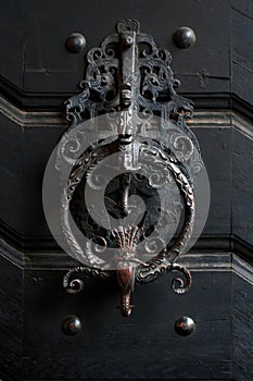 door knocker on an old wooden door in Czechia, Prague