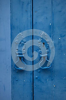 Door knockers on blue door in Lisbon photo