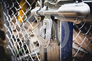 Door latches with an old metal fence net.