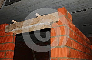 Door lintel. Building house construction. Door concrete lintel with unfinished house construction.