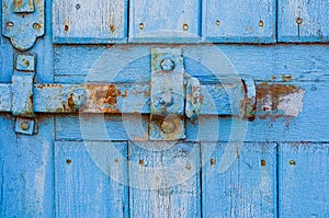 Door lock for key closing, keyhole, hasp bolt. Collection of old vintage retro locks on the textured colored door. Close-up