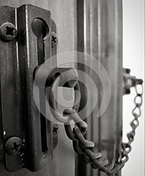 Door lock metal chain.  Black and white photo