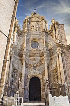 Door of Los Hierros and baroque facade of the cathedral of Valencia photo