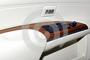Car door interior inside panel handle vehicle modern transportation transport automobile design leather lock luxury control wood