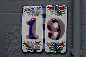 Door number 19 on concrete background
