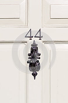 Door number 44 with door knocker