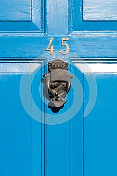 Door number 45 reflective sign with door knocker