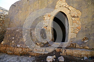 door of an old house built of cement and stones