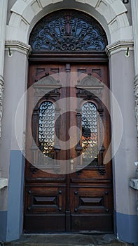 door. old wooden Front Door of a Traditional European Town House. Big Double Arch Door