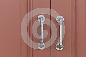 Door openers and dark brown wooden doors