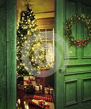 Door opening into a room with Christmas tree