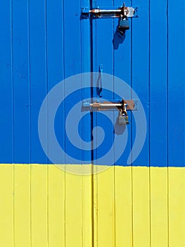 Door painted with Ukrainian flag colors in Hove