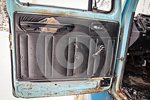 Door panel of an old truck with defect
