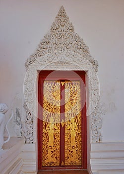 Door and sculpture caved in temple Thailand