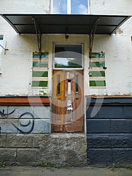 The door without stairs in brick wall