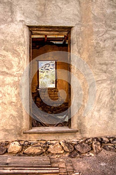 Door to the past in an old abandoned bunk house in the ghost town