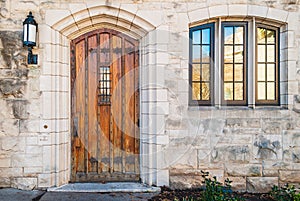 Door and window on stone facade