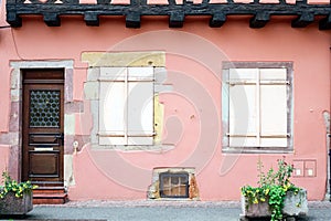 Door and windows of a pink house