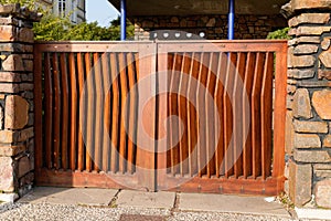 Door wooden high gate design in street view outdoor home entrance