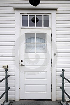 Door on a wooden white house