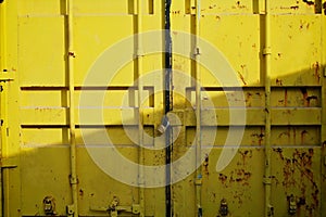 Door of yellow cargo container box background. Horizontal Shot.