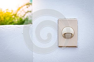 Doorbell or buzzer on mounted on wall