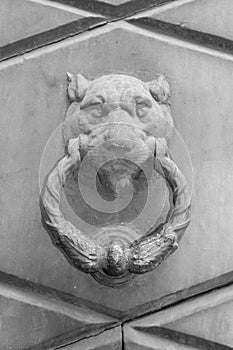 Doorknocker on the front door of the Italian building