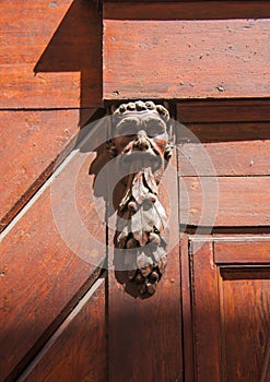 Doorknocker on the front door of the Italian building