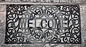 The Doormat curved steel of welcome text