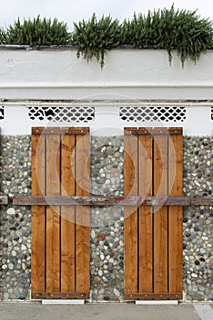 Doors covered and locked with wooden planks