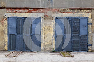Doors or gates of hangars in the industrial area. Background with copy space for text