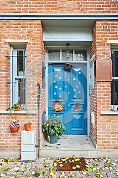 The doors of an old apartment building and decoration for Christmas or New year.