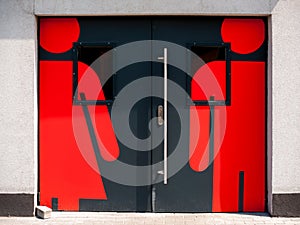 Doors to the toilet with signs of male and female