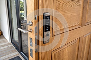Doorway with digital locking on wood door photo