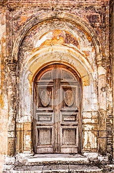 Doorway with layers of peeling paint.