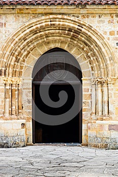 Doorway with multiple stone arches. Monastery of Santo Toribio de Liebana. Cantabria, Spain photo