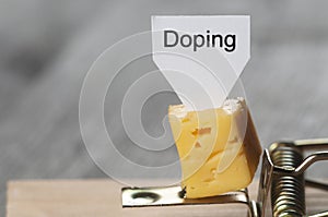 Doping sign on a cheese in mouse trap