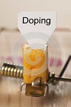 Doping sign on a cheese in mouse trap