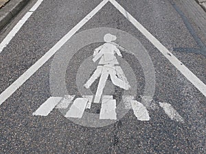 Doppelganger or double: warning sign at a crosswalk photo
