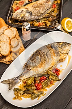 Dorada with okra and tomatoes