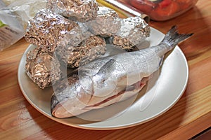 Dorado fish and potatoe in foil
