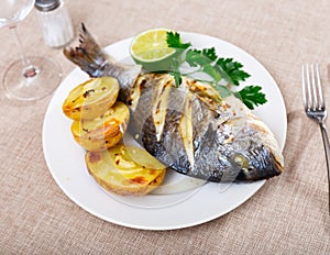 Dorado and potatoes baked in oven