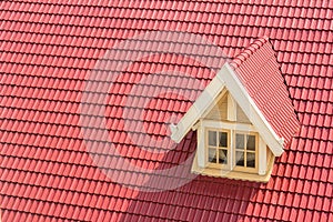 Dormer window on red roof