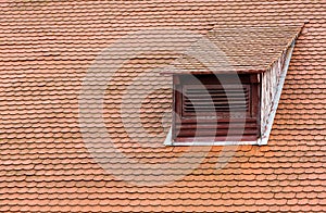 Dormer window and red roof tiles