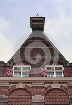 Dormer windows with open blinds.