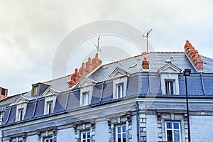 Dormer windows and roof of buildings in Nantes.