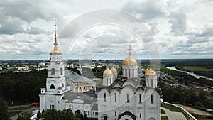 Dormition Cathedral on background with Vladimir cityscape in sunny summer day, Russia