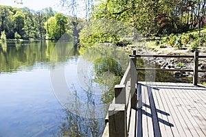 Dortmund Citys Romberg Park lake in North Rhine Westphalia sunny spring time with landing stage