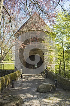 Dortmund, Ruhr Area, North Rhine Westphalia ,Germany - April 16 2018: Gatehouse of the castle BrÃÂ¼nninghausen at the park entrance